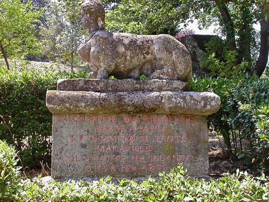 One of the sphinxes at the entrance of the park with the inscription: "Tu ch'entri qua con mente parte a parte et dimmi poi se tante meraviglie sien fatte per inganno o pur per arte."